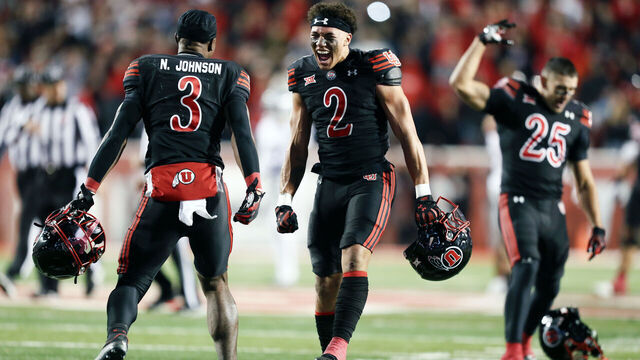 SALT LAKE CITY, UTAH - NOVEMBER 22: Smith Snowden #2 and Nate Johnson #3 of the Utah Utes celebrate their win over the Kansas State Wildcats at Rice-Eccles Stadium on November 22, 2025 in Salt Lake City, Utah.