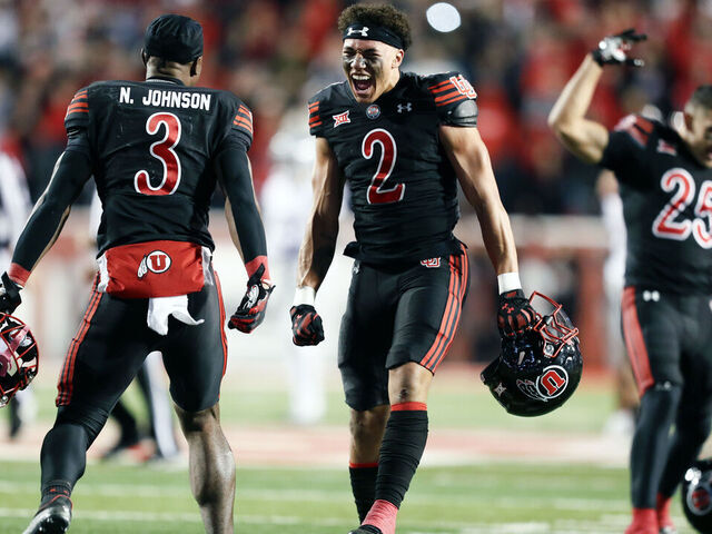 SALT LAKE CITY, UTAH - NOVEMBER 22: Smith Snowden #2 and Nate Johnson #3 of the Utah Utes celebrate their win over the Kansas State Wildcats at Rice-Eccles Stadium on November 22, 2025 in Salt Lake City, Utah.