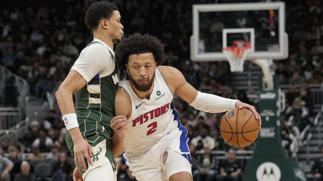 MILWAUKEE, WISCONSIN - NOVEMBER 22: Cade Cunningham #2 of the Detroit Pistons dribbles the ball against Ryan Rollins #13 of the Milwaukee Bucks during the third quarter at Fiserv Forum on November 22, 2025 in Milwaukee, Wisconsin.