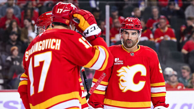 CALGARY, AB - NOVEMBER 22: Calgary Flames center Nazem Kadri (91) has a discussion with Calgary Flames center Yegor Sharangovich (17) during the Dallas Stars versus the Calgary Flames game on November 22, 2025, at Scotiabank Saddledome in Calgary, AB