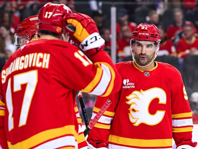 CALGARY, AB - NOVEMBER 22: Calgary Flames center Nazem Kadri (91) has a discussion with Calgary Flames center Yegor Sharangovich (17) during the Dallas Stars versus the Calgary Flames game on November 22, 2025, at Scotiabank Saddledome in Calgary, AB