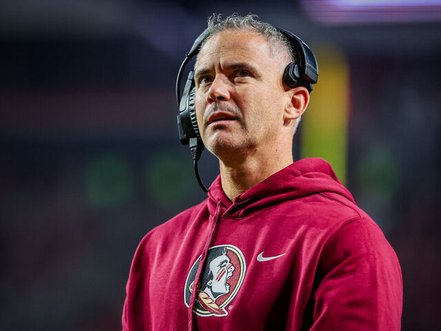RALEIGH, NORTH CAROLINA - NOVEMBER 21: Head Coach Mike Norvell of the Florida State Seminoles looks on during the first half of a football game against the NC State Wolfpack at Carter-Finley Stadium on November 21, 2025 in Raleigh, North Carolina.