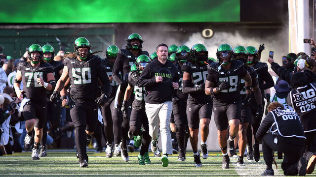 EUGENE, OR - NOVEMBER 22: Oregon Ducks head coach Dan Lanning leads his team onto the field before a college football game between the USC Trojans and Oregon Ducks on November 22, 2025, at Autzen Stadium in Eugene, Oregon.