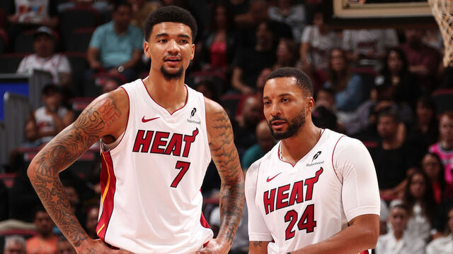 MIAMI, FL - NOVEMBER 8: Kel'el Ware #7 and Norman Powell #24 of the Miami Heat look on during the game against the Portland Trail Blazers on November 8, 2025 at Kaseya Center in Miami, Florida. Mandatory Copyright Notice: Copyright 2025 NBAE
