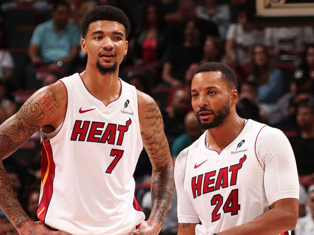 MIAMI, FL - NOVEMBER 8: Kel'el Ware #7 and Norman Powell #24 of the Miami Heat look on during the game against the Portland Trail Blazers on November 8, 2025 at Kaseya Center in Miami, Florida. Mandatory Copyright Notice: Copyright 2025 NBAE