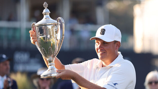 ST SIMONS ISLAND, GEORGIA - NOVEMBER 23: Sami Valimaki of Finland is presented the winner's trophy after winning The RSM Classic 2025 at Sea Island Resort on November 23, 2025 in St Simons Island, Georgia.