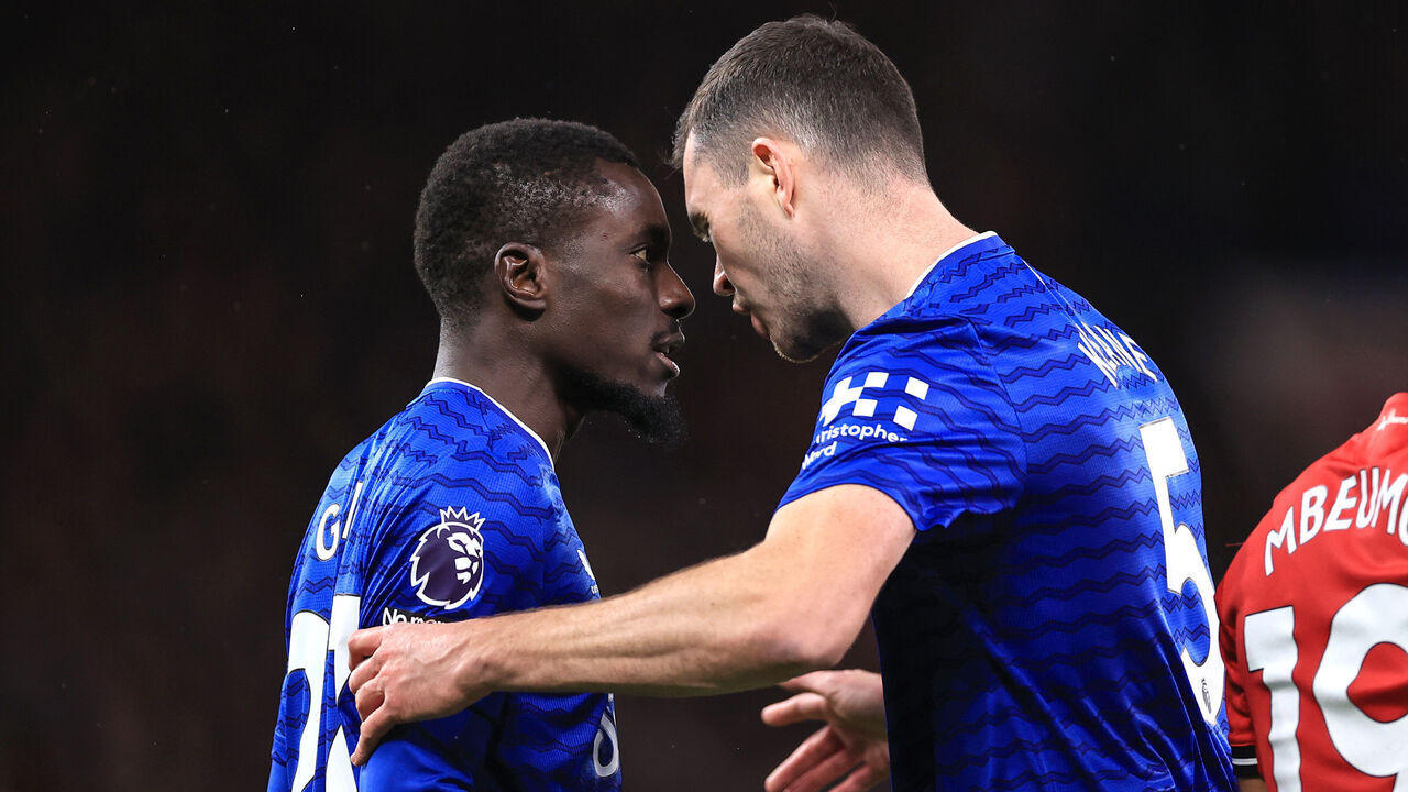 MANCHESTER, ENGLAND - NOVEMBER 24: Idrissa Gueye of Everton clashes with teammate Michael Keane resulting in a red card for Gueye during the Premier League match between Manchester United and Everton at Old Trafford on November 24, 2025 in Manchester, England.