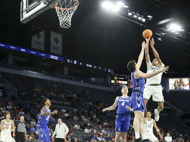 LAS VEGAS, NEVADA - NOVEMBER 24: Cameron Carr #43 of the Baylor Bears shoots against Kerem Konan #17 of the Creighton Bluejays during the first half of a Players Era Championship basketball tournament at Michelob ULTRA Arena on November 24, 2025 in Las Vegas, Nevada.