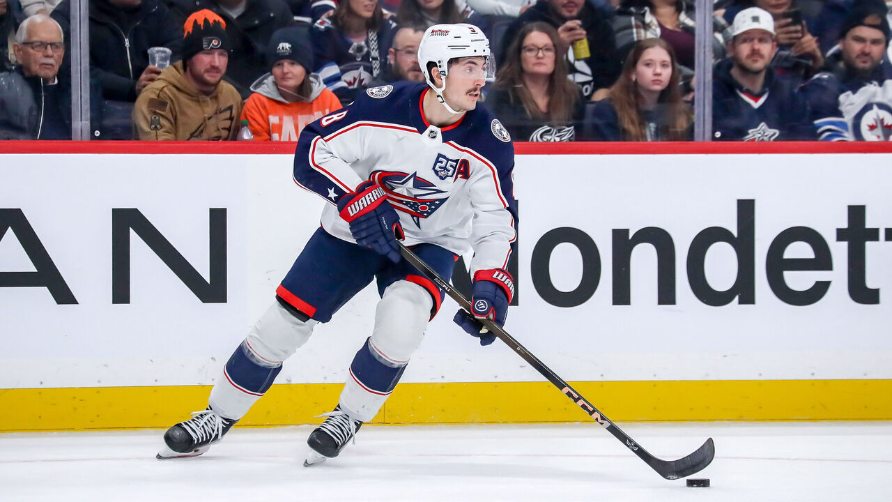 WINNIPEG, CANADA - NOVEMBER 18: Zach Werenski #8 of the Columbus Blue Jackets plays the puck up the ice during second period action against the Winnipeg Jets at the Canada Life Centre on November 18, 2025 in Winnipeg, Manitoba, Canada. The Jets defeated the Jackets 5-2.