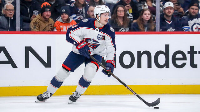 WINNIPEG, CANADA - NOVEMBER 18: Zach Werenski #8 of the Columbus Blue Jackets plays the puck up the ice during second period action against the Winnipeg Jets at the Canada Life Centre on November 18, 2025 in Winnipeg, Manitoba, Canada. The Jets defeated the Jackets 5-2.