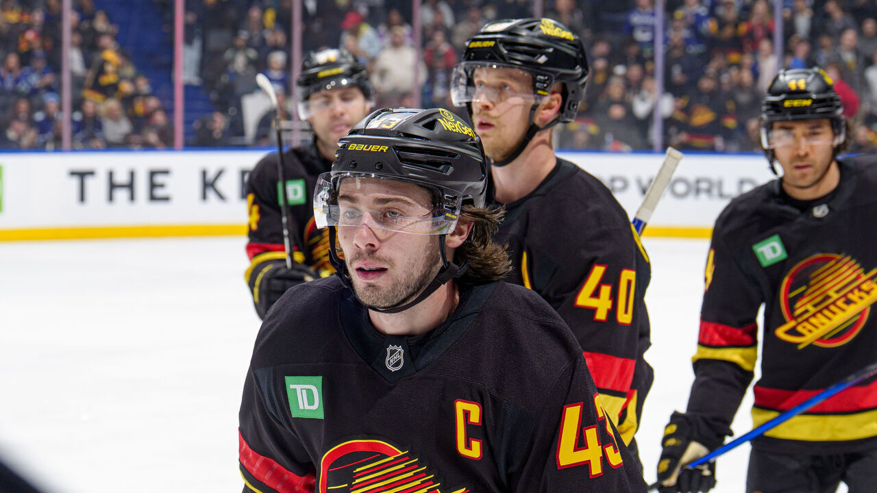 VANCOUVER, CANADA - NOVEMBER 23: Quinn Hughes #43 of the Vancouver Canucks skates back to the bench after he scores a goal during the third period of their NHL game against the Calgary Flames at Rogers Arena on November 23, 2025 in Vancouver, British Columbia, Canada.