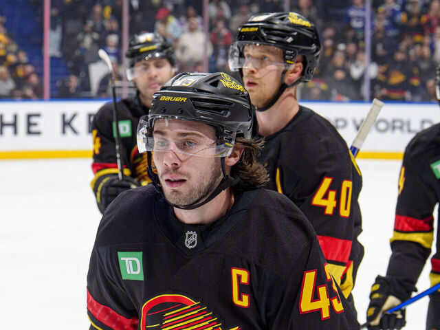 VANCOUVER, CANADA - NOVEMBER 23: Quinn Hughes #43 of the Vancouver Canucks skates back to the bench after he scores a goal during the third period of their NHL game against the Calgary Flames at Rogers Arena on November 23, 2025 in Vancouver, British Columbia, Canada.