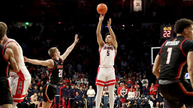 TUCSON, AZ - NOVEMBER 24: Arizona Wildcats guard Brayden Burries (5) shoots over Denver Pioneers guard Carson Johnson (20) during the first half of a basketball game between the Denver Pioneers and the Arizona Wildcats on November 24, 2025, at McKale Center in Tucson, AZ.