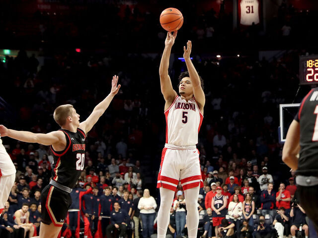 TUCSON, AZ - NOVEMBER 24: Arizona Wildcats guard Brayden Burries (5) shoots over Denver Pioneers guard Carson Johnson (20) during the first half of a basketball game between the Denver Pioneers and the Arizona Wildcats on November 24, 2025, at McKale Center in Tucson, AZ.