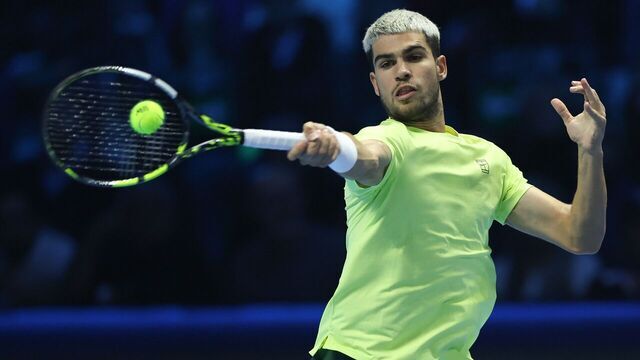 Carlos Alcaraz returns a shot during the men's singles final match between Jannik Sinner of Italy and Carlos Alcaraz of Spain at the ATP Finals tennis tournament in Turin, Italy, on Nov. 16, 2025.