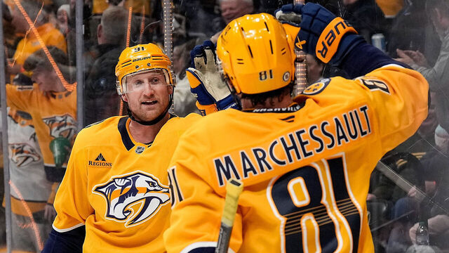 NASHVILLE, TENNESSEE - JANUARY 14: Steven Stamkos #91 celebrates his goal with Jonathan Marchessault #81 of the Nashville Predators against the Vegas Golden Knights during an NHL game at Bridgestone Arena on January 14, 2025 in Nashville, Tennessee.