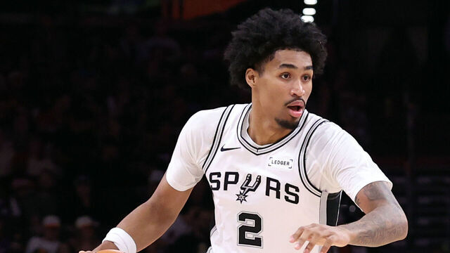 PHOENIX, ARIZONA - NOVEMBER 02: Dylan Harper #2 of the San Antonio Spurs dribbles the ball during the first half against the Phoenix Suns at Mortgage Matchup Center on November 02, 2025 in Phoenix, Arizona. The Suns defeated the Spurs 130-118.