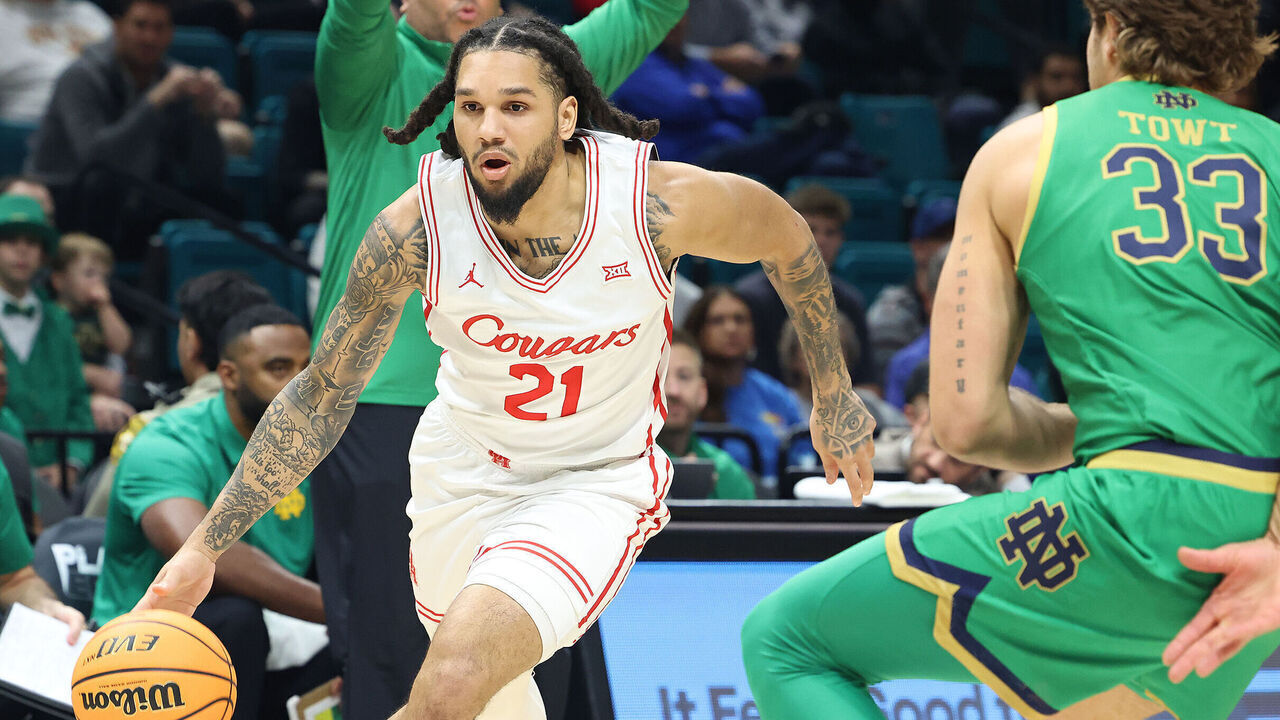 LAS VEGAS, NV - NOVEMBER 26: Houston Cougars guard Emanuel Sharp (21) in action during the Players Era Festival on Wednesday, Nov. 26, 2025, at the Michelob ULTRA Arena at Mandalay Bay Resort and Casino in Las Vegas, NV.