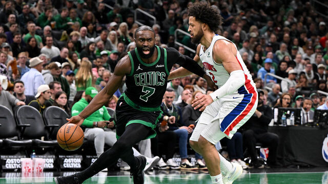 BOSTON, MASSACHUSETTS - NOVEMBER 26: Jaylen Brown #7 of the Boston Celtics dribbles the ball to the basket against Cade Cunningham #2 of the Detroit Pistons during the second half at the TD Garden on November 26, 2025 in Boston, Massachusetts.