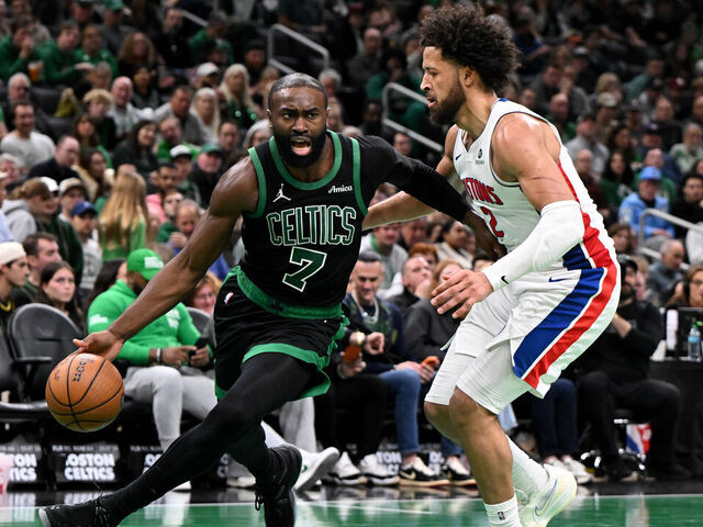 BOSTON, MASSACHUSETTS - NOVEMBER 26: Jaylen Brown #7 of the Boston Celtics dribbles the ball to the basket against Cade Cunningham #2 of the Detroit Pistons during the second half at the TD Garden on November 26, 2025 in Boston, Massachusetts.
