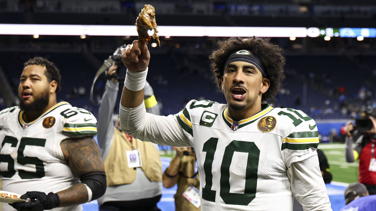 DETROIT, MICHIGAN - NOVEMBER 27: Jordan Love #10 of the Green Bay Packers celebrates with a turkey leg after an NFL football game on Thanksgiving Day against the Detroit Lions at Ford Field on November 27, 2025 in Detroit, Michigan.
