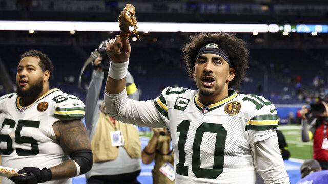DETROIT, MICHIGAN - NOVEMBER 27: Jordan Love #10 of the Green Bay Packers celebrates with a turkey leg after an NFL football game on Thanksgiving Day against the Detroit Lions at Ford Field on November 27, 2025 in Detroit, Michigan.