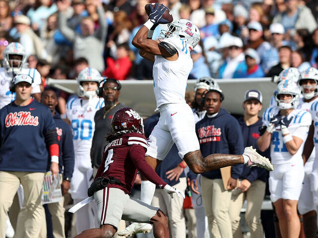 STARKVILLE, MISSISSIPPI - NOVEMBER 28: De'Zhaun Stribling #1 of the Mississippi Rebels catches a pass against Deago Brumfield #4 of the Mississippi State Bulldogs during the first half at Davis Wade Stadium on November 28, 2025 in Starkville, Mississippi.