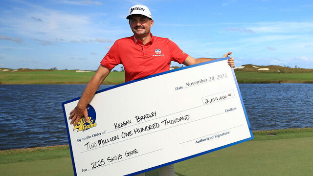 PALM BEACH GARDENS, FLORIDA - NOVEMBER 28: Keegan Bradley of the United States celebrates with his check after winning The Skins Game at Panther National on November 28, 2025 in Palm Beach Gardens, Florida.