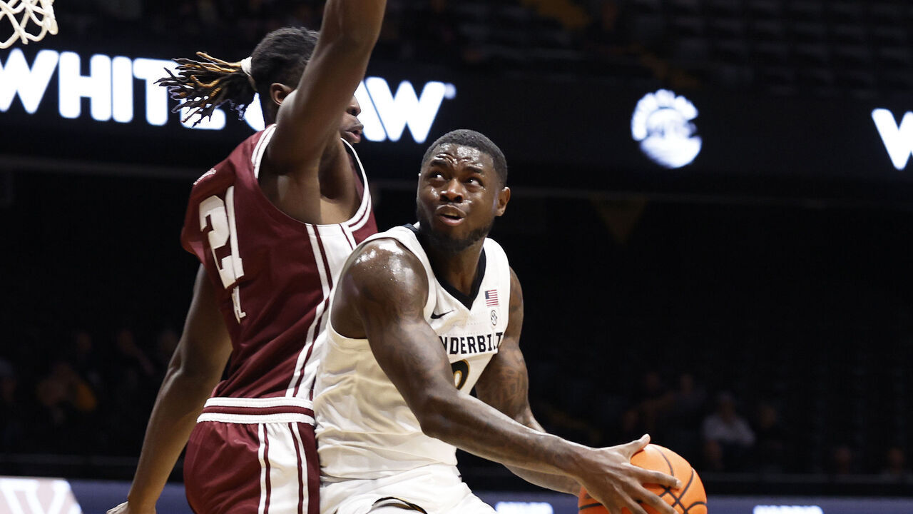 NASHVILLE, TN - NOVEMBER 12: Vanderbilt Commodores guard Duke Miles (2) makes a move around Eastern Kentucky Colonels forward Yvens Paul (21) during a game between the Vanderbilt Commodores and Eastern Kentucky Colonels, November 12, 2025, at Memorial Gymnasium in Nashville, Tennessee.