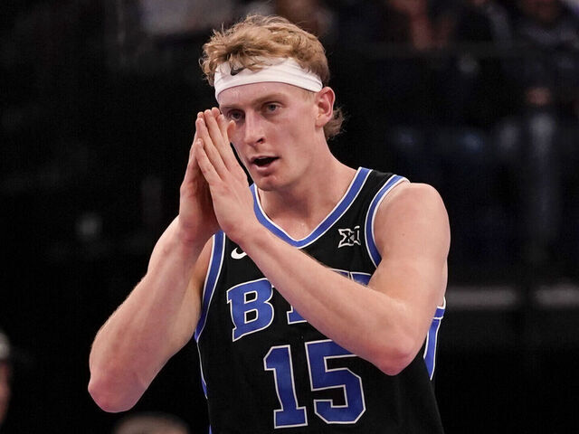 SALT LAKE CITY, UT - NOVEMBER 21: Richie Saunders #15 of the BYU Cougars reacts during a college basketball game between the Wisconsin Badgers and the BYU Cougars at the Delta Center, in Salt Lake City, UT.