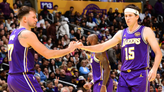 LOS ANGELES, CA - NOVEMBER 25: Austin Reaves #15 and Luka Doncic #77 of the Los Angeles Lakers high five during the game against the LA Clippers during the 2025-26 Emirates Cup on November 25, 2025 at Crypto.Com Arena in Los Angeles, California. NOTE TO USER: User expressly acknowledges and agrees that, by downloading and/or using this Photograph, user is consenting to the terms and conditions of the Getty Images License Agreement. Mandatory Copyright Notice: Copyright 2025 NBAE