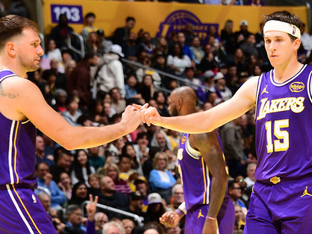 LOS ANGELES, CA - NOVEMBER 25: Austin Reaves #15 and Luka Doncic #77 of the Los Angeles Lakers high five during the game against the LA Clippers during the 2025-26 Emirates Cup on November 25, 2025 at Crypto.Com Arena in Los Angeles, California. NOTE TO USER: User expressly acknowledges and agrees that, by downloading and/or using this Photograph, user is consenting to the terms and conditions of the Getty Images License Agreement. Mandatory Copyright Notice: Copyright 2025 NBAE