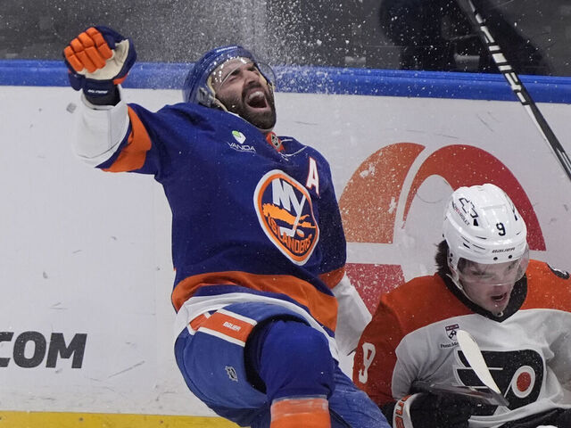 ELMONT, NY - NOVEMBER 28: New York Islanders Center Kyle Palmieri (21) and Philadelphia Flyers Defenseman Jamie Drysdale (9) collide on the ice during the second period of the National Hockey League game on November 28, 2025, at UBS Arena in Elmont, NY.