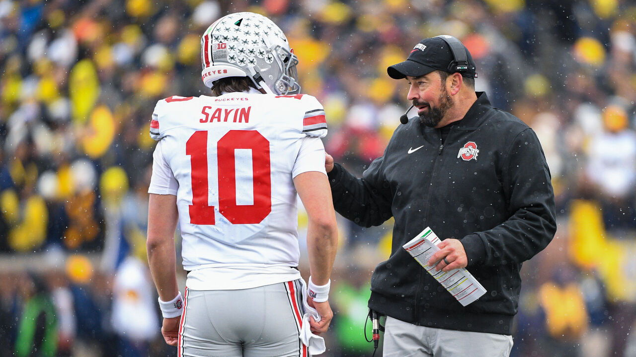 ANN ARBOR, MICHIGAN - NOVEMBER 29: Head Football Coach Ryan Day (R) gives instructions to Julian Sayin #10 of the Ohio State Buckeyes during the first half of a college football game against the Michigan Wolverines at Michigan Stadium on November 29, 2025 in Ann Arbor, Michigan.