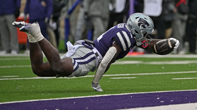 MANHATTAN, KS - NOVEMBER 29: Running back Joe Jackson #4 of the Kansas State Wildcats dives across the goal line for a touchdown againt the Colorado Buffaloes in the second half at Bill Snyder Family Football Stadium on November 29, 2025 in Manhattan, Kansas.
