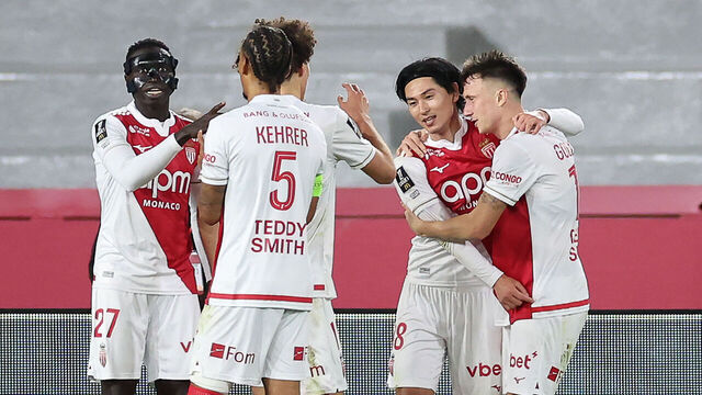 Monaco's Japanese forward #18 Takumi Minamino (2R) celebrates with teammares after scoring his team's first goal during the French L1 football match between AS Monaco and Paris Saint-Germain (PSG) at the Stade Louis II in the Principality of Monaco on November 29, 2025.