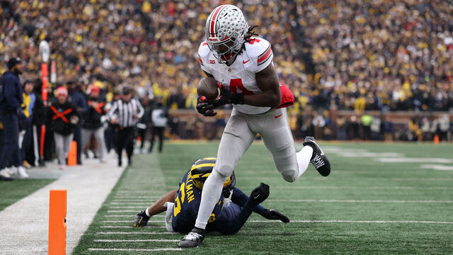 ANN ARBOR, MICHIGAN - NOVEMBER 29: Jeremiah Smith #4 of the Ohio State Buckeyes runs for a touchdown during the second quarter against the Michigan Wolverines at Michigan Stadium on November 29, 2025 in Ann Arbor, Michigan.