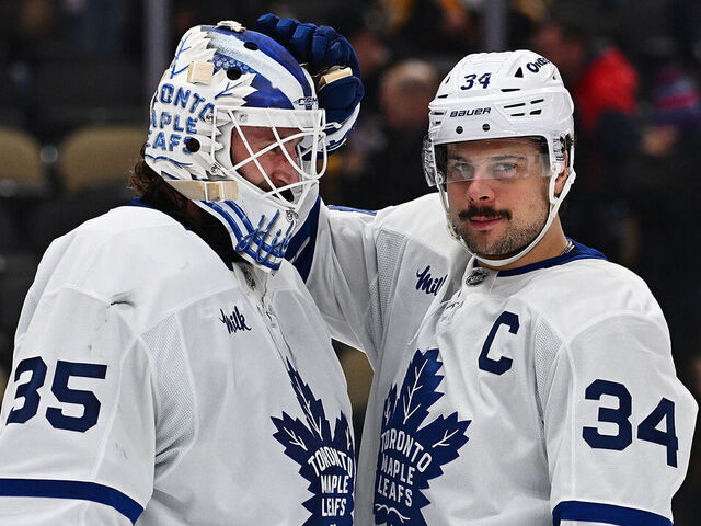 PITTSBURGH, PENNSYLVANIA - NOVEMBER 29: Auston Matthews #34 of the Toronto Maple Leafs celebrates with Dennis Hildeby #35 following a 7-2 win over the Pittsburgh Penguins during the game at PPG PAINTS Arena on November 29, 2025 in Pittsburgh, Pennsylvania.
