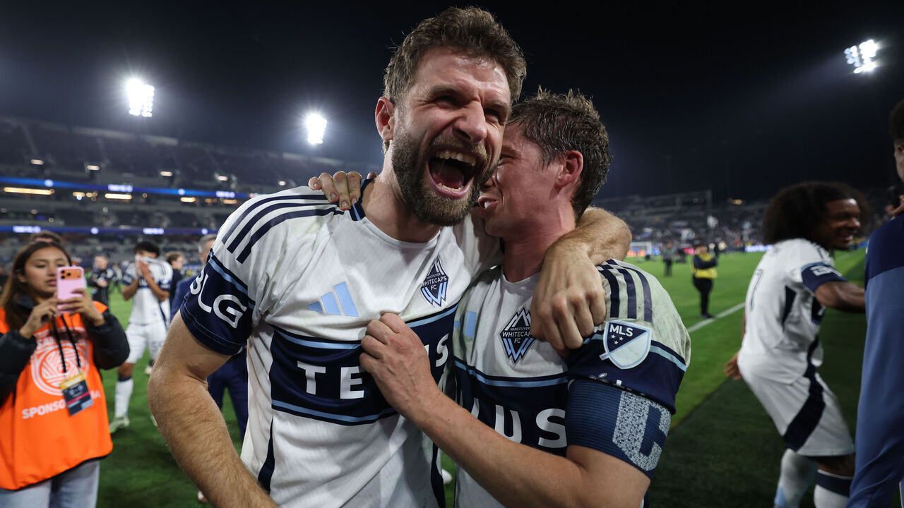 SAN DIEGO, CALIFORNIA - NOVEMBER 29: Thomas Müller #13 and Ryan Gauld #25 of the Vancouver Whitecaps FC celebrate after winning the Audi 2025 MLS Cup western conference final match between San Diego FC and Vancouver Whitecaps FC at Snapdragon Stadium on November 29, 2025 in San Diego, California.