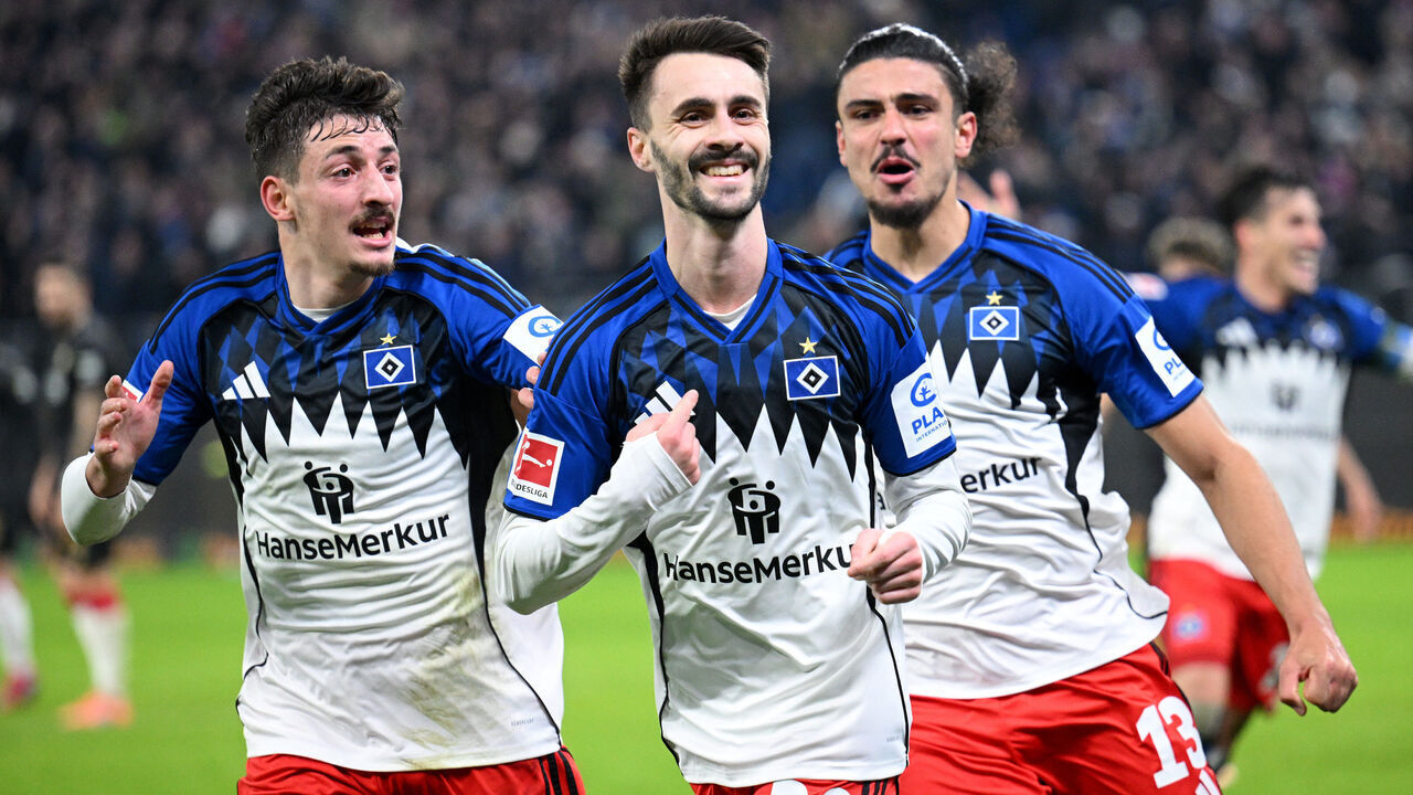 HAMBURG, GERMANY - NOVEMBER 30: Fabio Vieira of Hamburger SV celebrates scoring his team's second goal with teammates Guilherme Ramos and Giorgi Gocholeishvili during the Bundesliga match between Hamburger SV and VfB Stuttgart at Volksparkstadion on November 30, 2025 in Hamburg, Germany.