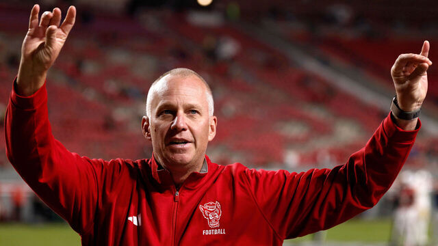 RALEIGH, NORTH CAROLINA - NOVEMBER 1: Head coach Dave Doeren of the NC State Wolfpack fires up the crown prior to the game against the Georgia Tech Yellow Jackets at Carter-Finley Stadium on November 1, 2025 in Raleigh, North Carolina.