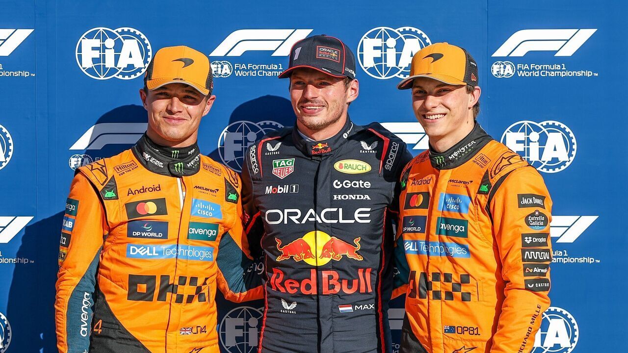 Pole position qualifier Red Bull's Dutch driver Max Verstappen C, second-placed McLaren's British driver Lando Norris L and third-placed McLaren's Australian driver Oscar Piastri pose after the qualifying session of the Formula 1 Italian Grand Prix at Monza Circuit, near Milan, Italy, on Sept. 6, 2025.