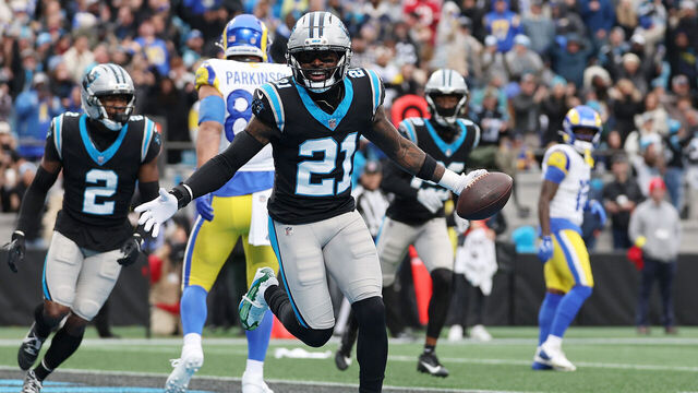 CHARLOTTE, NORTH CAROLINA - NOVEMBER 30: Nick Scott #21 of the Carolina Panthers celebrates after his interception against the Los Angeles Rams during the first quarter at Bank of America Stadium on November 30, 2025 in Charlotte, North Carolina.