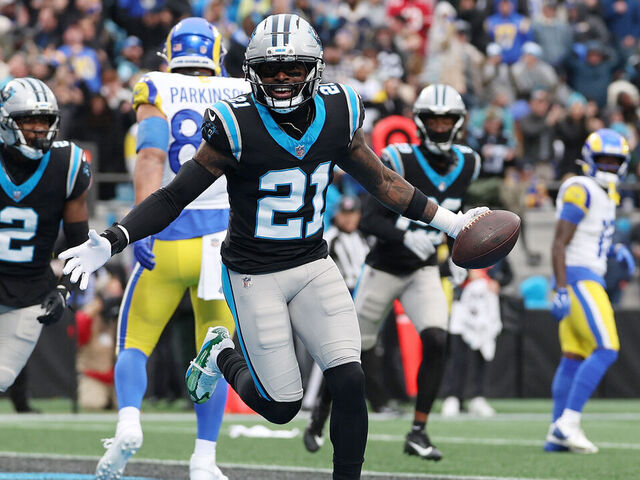 CHARLOTTE, NORTH CAROLINA - NOVEMBER 30: Nick Scott #21 of the Carolina Panthers celebrates after his interception against the Los Angeles Rams during the first quarter at Bank of America Stadium on November 30, 2025 in Charlotte, North Carolina.