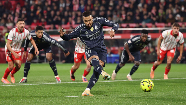 Real Madrid's French forward #10 Kylian Mbappe scores a goal from the penalty spot during the Spanish league football match between Girona FC and Real Madrid CF at Montilivi Stadium in Girona on November 30, 2025.