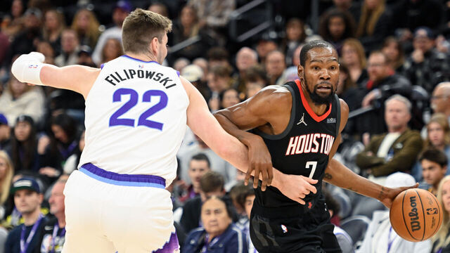 SALT LAKE CITY, UTAH - NOVEMBER 30: Kevin Durant #7 of the Houston Rockets dribbles the ball around Kyle Filipowski #22 of the Utah Jazz during the first half of the game at Delta Center on November 30, 2025 in Salt Lake City, Utah.