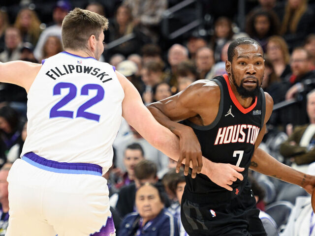 SALT LAKE CITY, UTAH - NOVEMBER 30: Kevin Durant #7 of the Houston Rockets dribbles the ball around Kyle Filipowski #22 of the Utah Jazz during the first half of the game at Delta Center on November 30, 2025 in Salt Lake City, Utah.