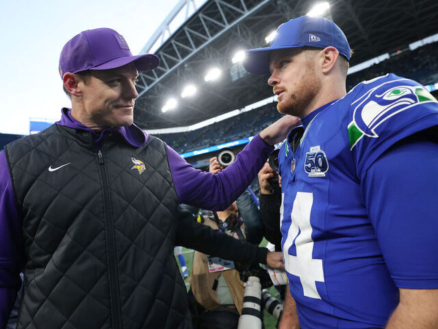 SEATTLE, WASHINGTON - NOVEMBER 30: Head coach Kevin O'Connell of the Minnesota Vikings and Sam Darnold #14 of the Seattle Seahawks hug after Seattle's 26-0 victory at Lumen Field on November 30, 2025 in Seattle, Washington.