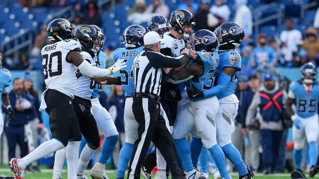NASHVILLE, TENNESSEE - NOVEMBER 30: The Jacksonville Jaguars and Tennessee Titans scuffle during the second half at Nissan Stadium on November 30, 2025 in Nashville, Tennessee.