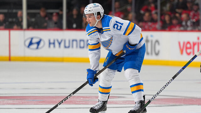 NEWARK, NJ - NOVEMBER 26: Jimmy Snuggerud #21 of the St. Louis Blues during a face off during the game against the New Jersey Devils on November 26, 2025 at the Prudential Center in Newark, New Jersey.